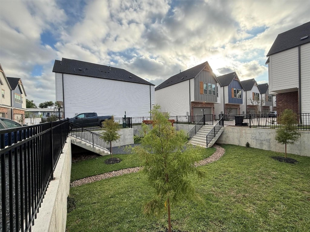 2200 Marnel Road, Unit I Houston, TX 77055 - Photo 22 of 25 a view of a house with a yard fire pit and outdoor seating