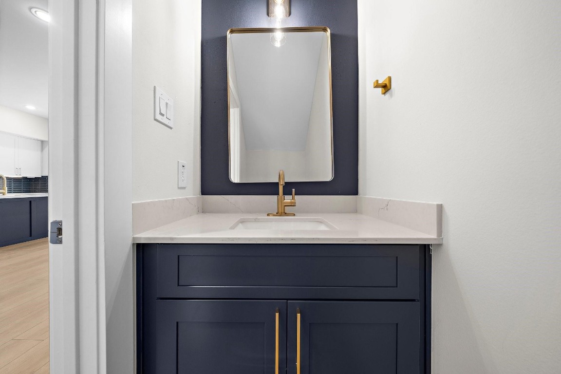 2200 Marnel Road, Unit I Houston, TX 77055 - Photo 5 of 25 a bathroom with a sink and a mirror