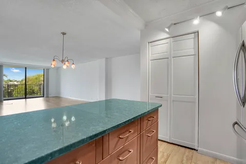 a view of a kitchen cabinets and a wooden floor