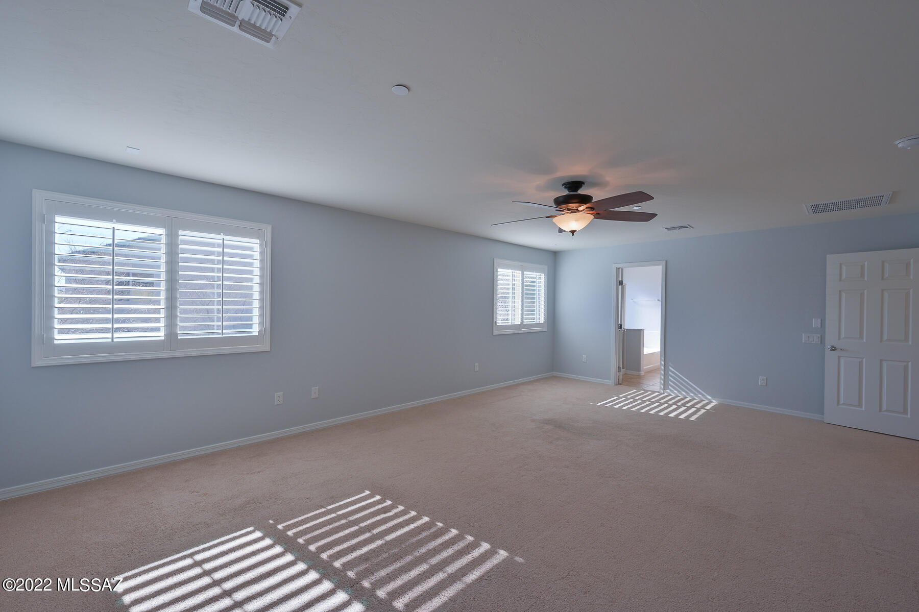 10804 East Salsabila Road Tucson, AZ 85747 - Photo 7 of 50 a view of a livingroom with a ceiling fan and window