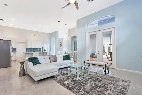 a living room with furniture and a rug