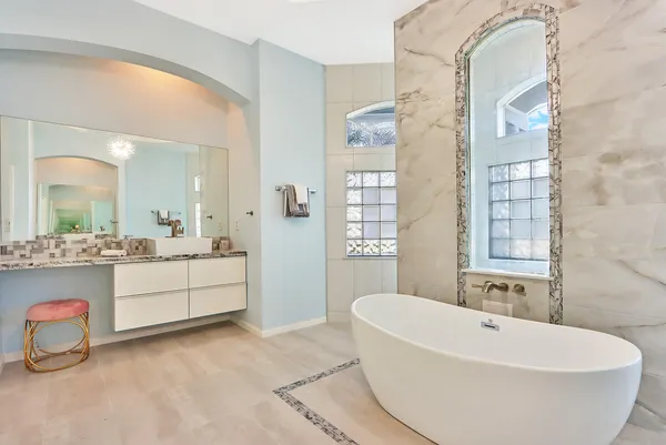 a bathroom with a bathtub and a sink