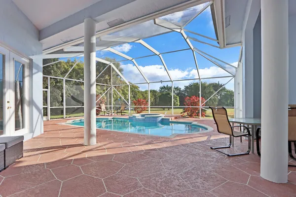 a view of a swimming pool with a porch