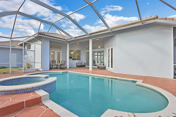 a view of a swimming pool with a patio