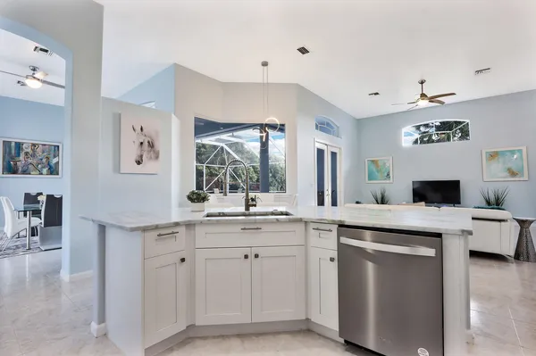 a kitchen with cabinets and window
