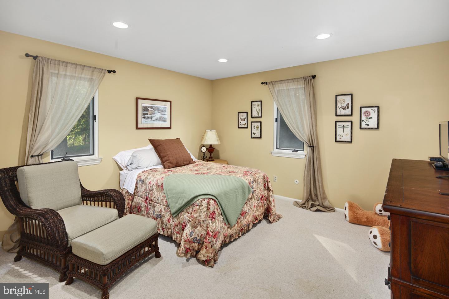 428 Round Hill Road Wayne, PA 19087 - Photo 22 of 31 a bedroom with a bed and a couch