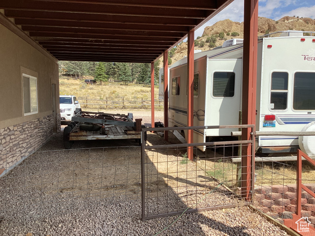 3 Red Circle, Unit 19 Manila, UT 84046 - Photo 24 of 29 View of patio featuring an attached carport and a mountain view