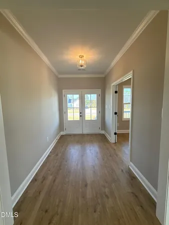 a view of empty room with fireplace and fan