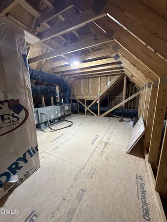 a view of an empty room with windows