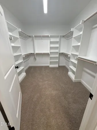 a bathroom with double vanity sinks and a mirror