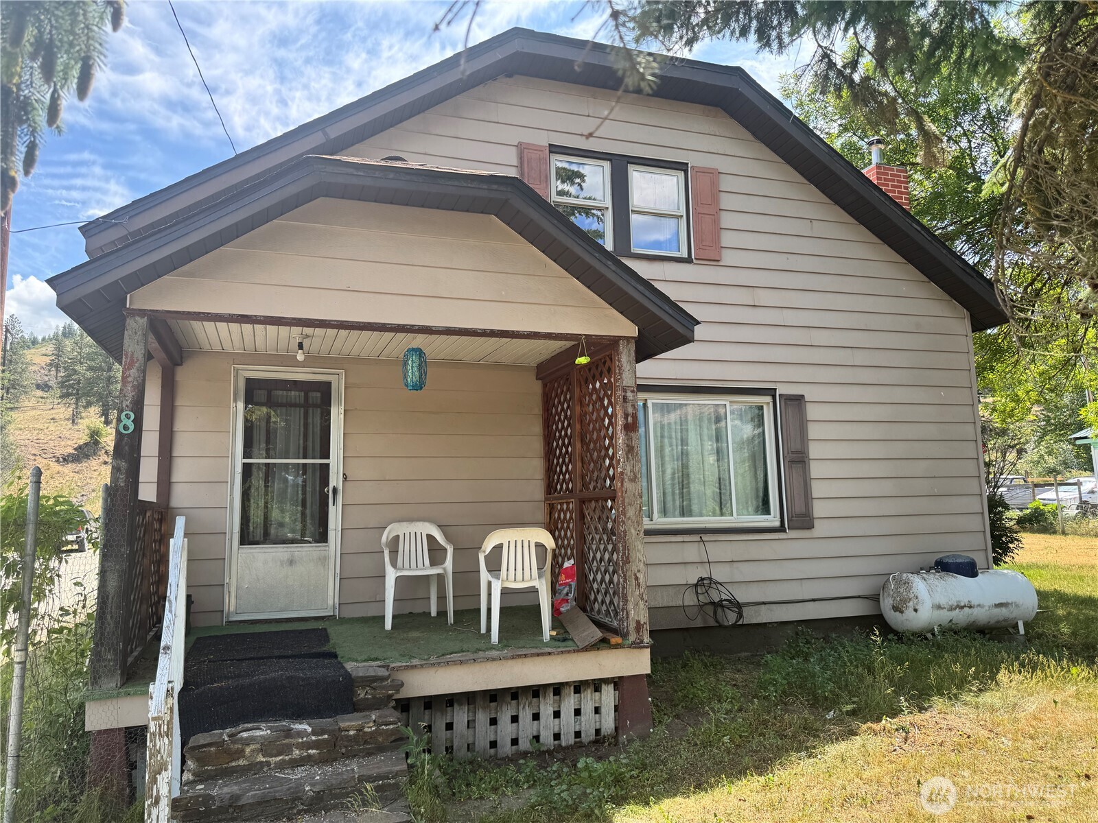 a front view of a house with garden