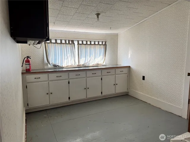 a view of cabinets and a wooden floor