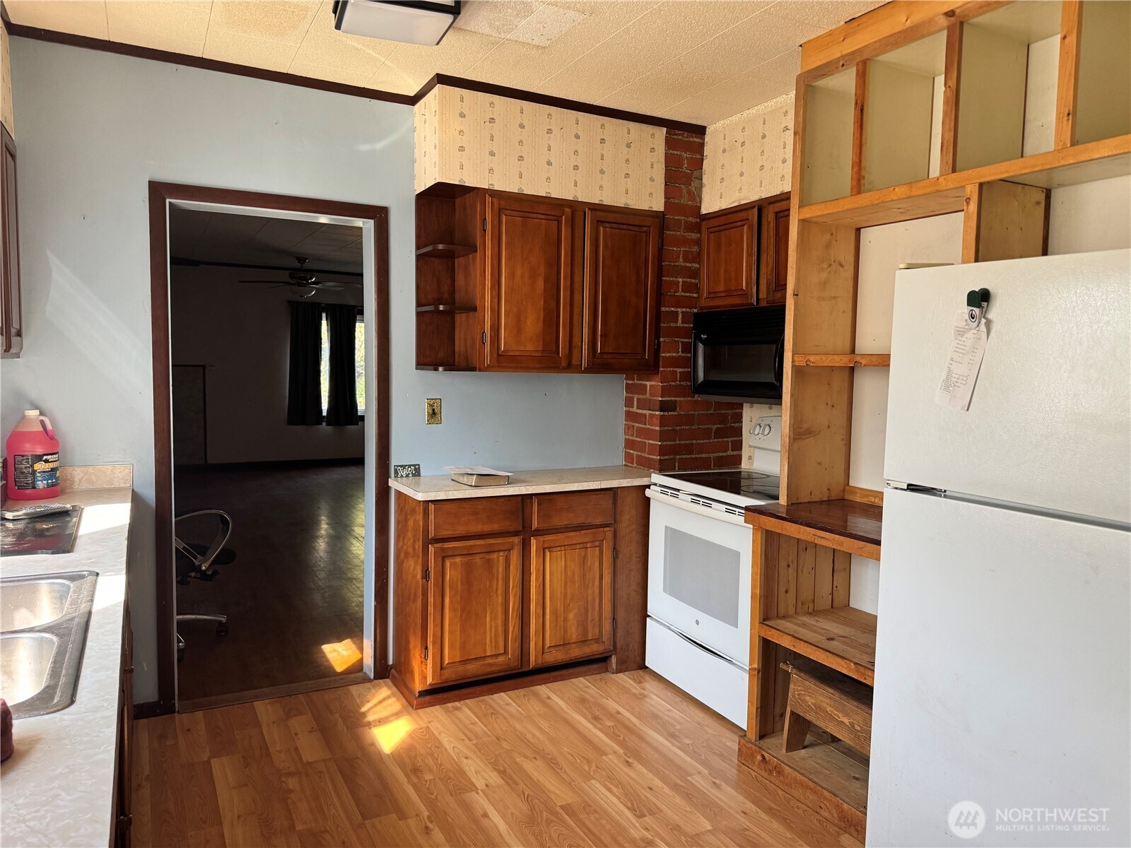 8 South Main Street Curlew, WA 99118 - Photo 22 of 25 a kitchen with stainless steel appliances granite countertop a refrigerator and a stove