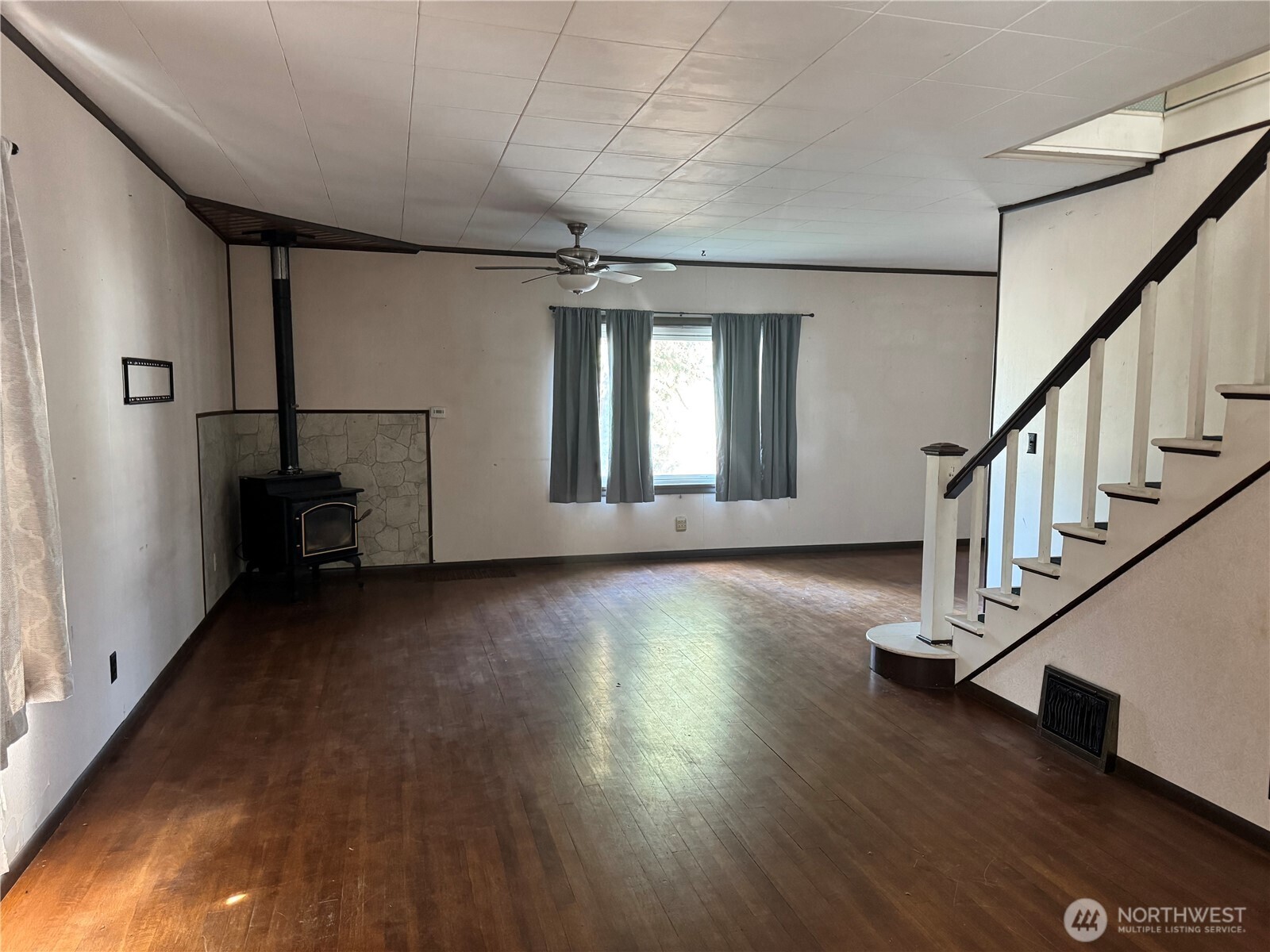 8 South Main Street Curlew, WA 99118 - Photo 23 of 25 a view of a livingroom with wooden floor and stairs