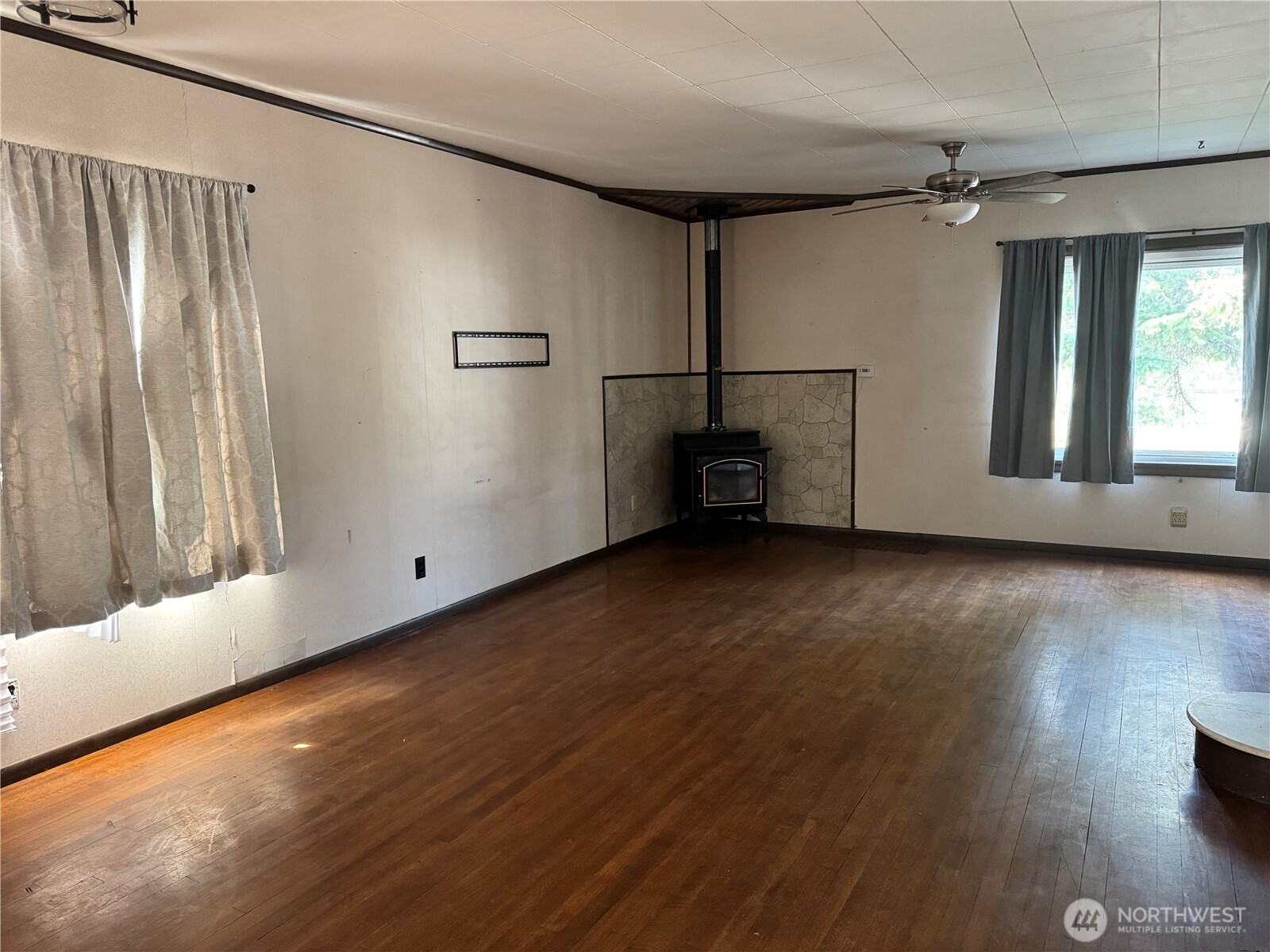 8 South Main Street Curlew, WA 99118 - Photo 24 of 25 a view of a livingroom with wooden floor and a window