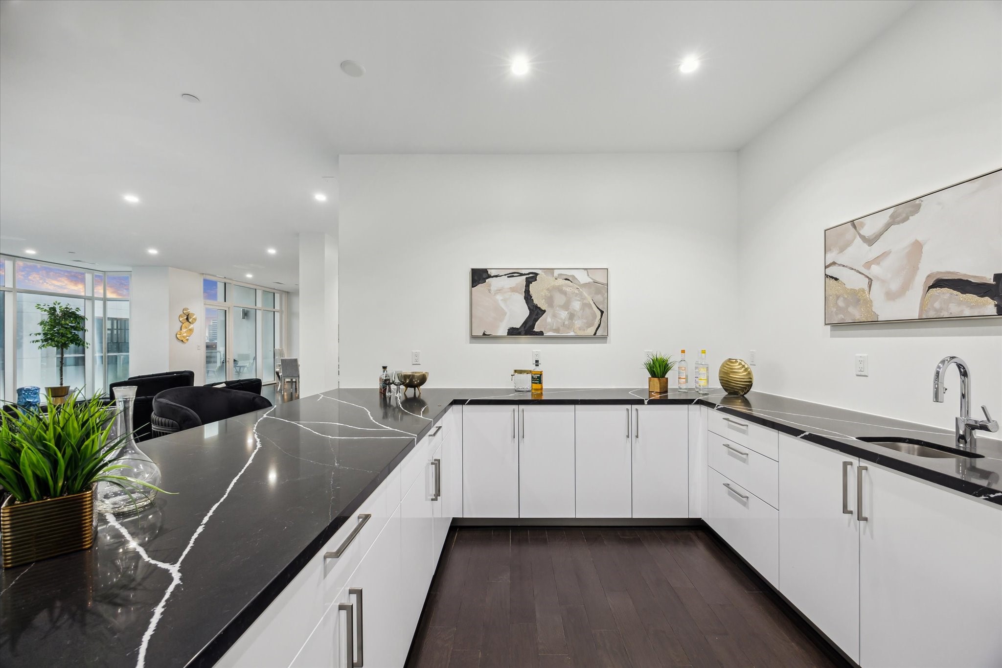 4521 San Felipe Street, Unit 23045 Houston, TX 77027 - Photo 18 of 25 a large white kitchen with stainless steel appliances a sink and a large window