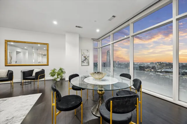 a view of a dining room with furniture window and wooden floor