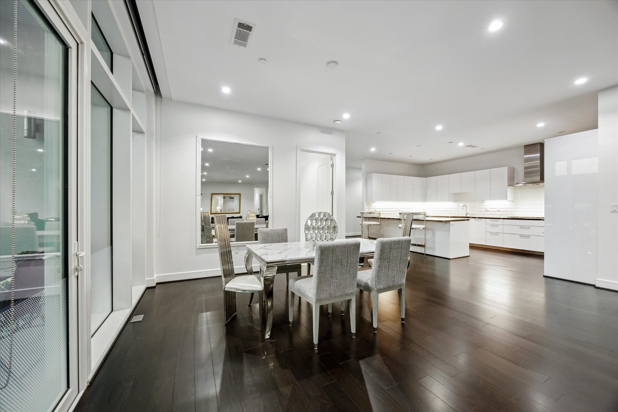 4521 San Felipe Street, Unit 23045 Houston, TX 77027 - Photo 4 of 25 a view of a dining area with furniture and wooden floor