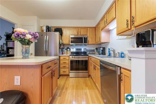 a kitchen with a sink stove and microwave