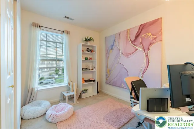 a view of a workspace with furniture