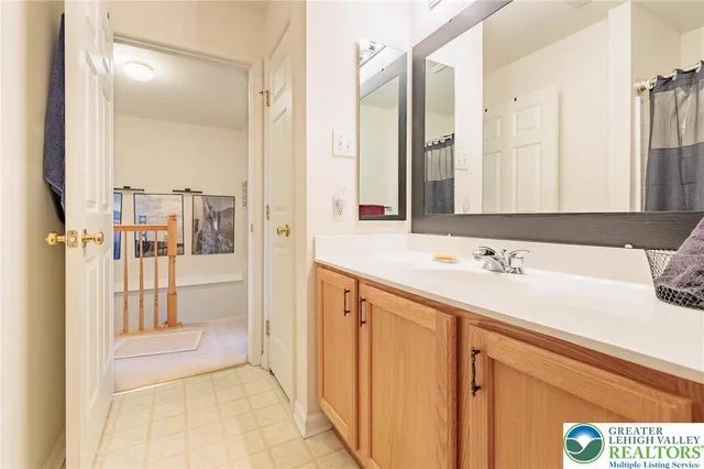 a view of a chair and table in backyard of the house