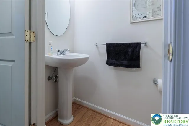 a bathroom with a sink and mirror