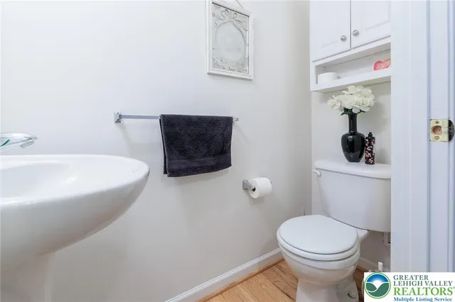 a bathroom with a toilet and a sink