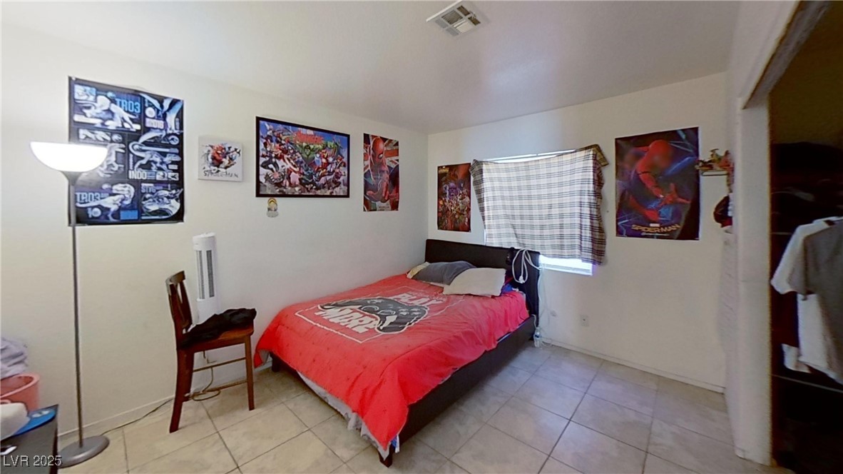 2201 James Bilbray Drive Las Vegas, NV 89108 - Photo 27 of 33 Bedroom featuring light tile patterned floors