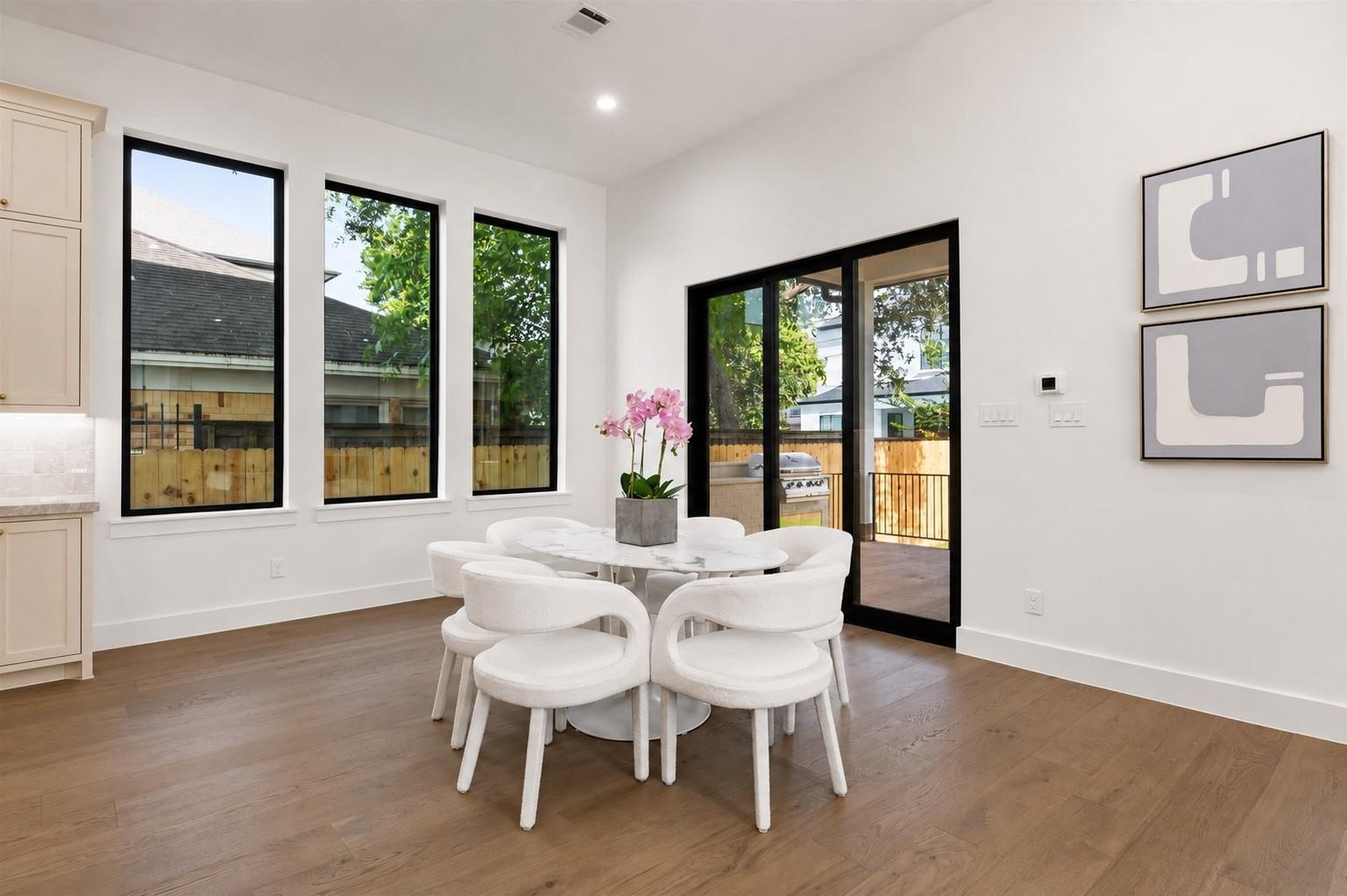 2325 Wroxton Road Houston, TX 77005 - Photo 8 of 34 Oversized breakfast room with views to the oversized yard and outdoor kitchen. Paneled Sliding glass doors allow for indoor outdoor living