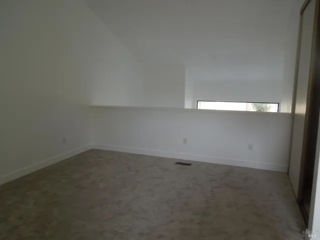 a view of wooden floor and a fireplace in a room