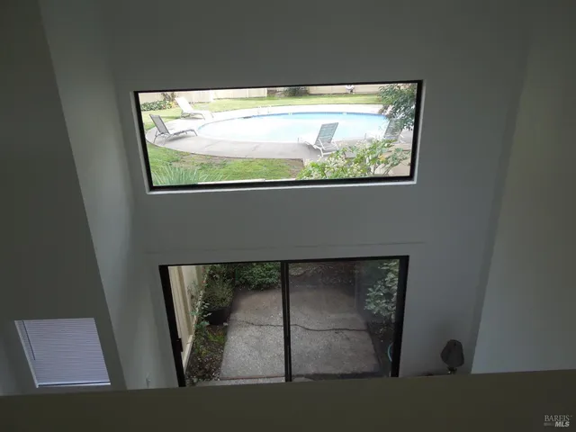 a view of a swimming pool with a yard