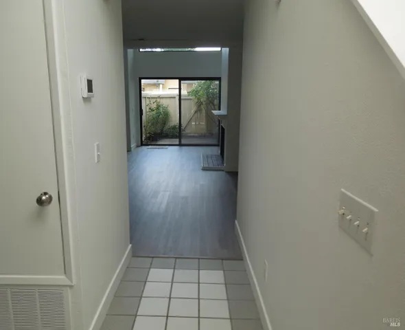 a bathroom with a sink and glass door