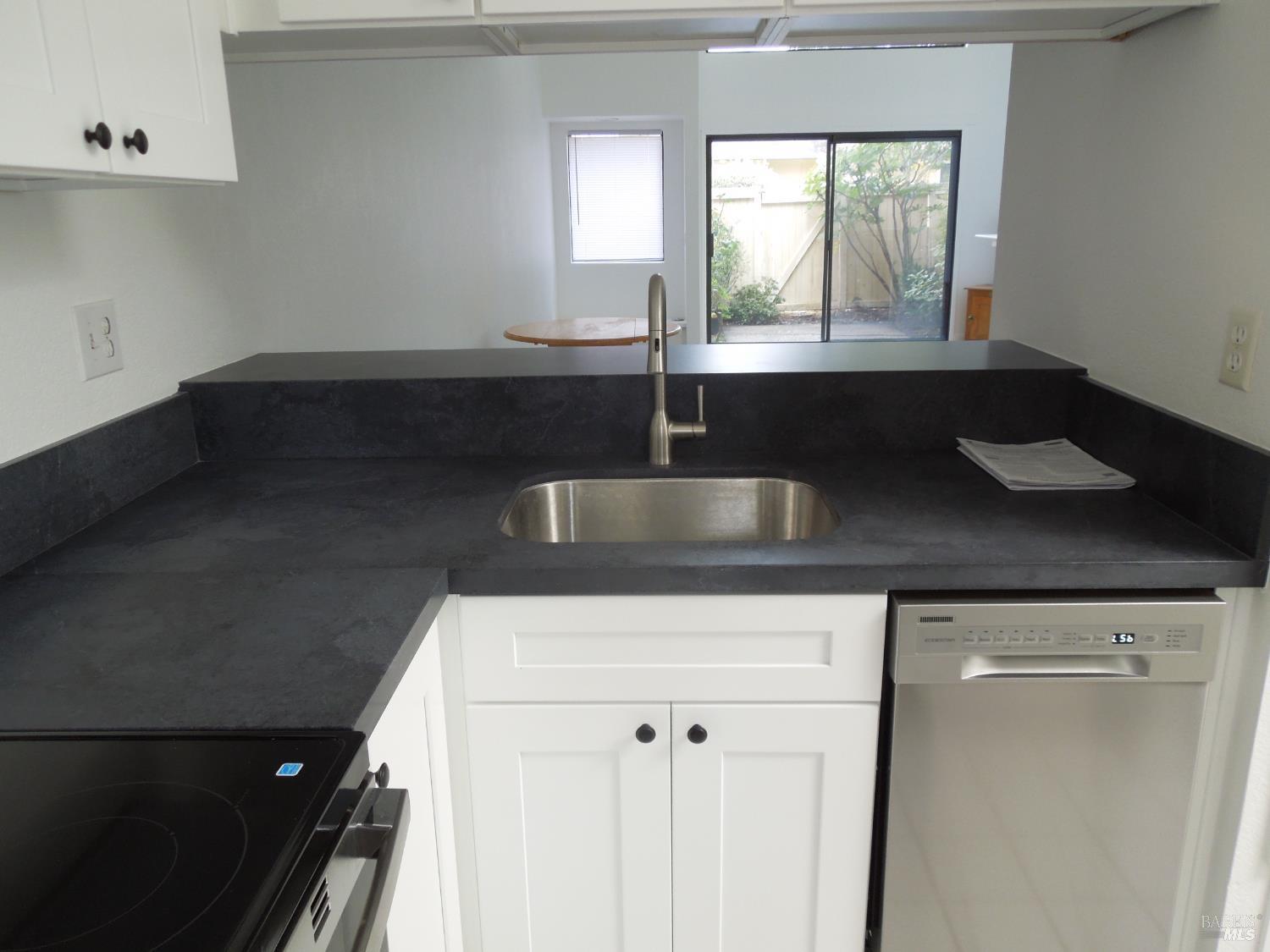 2802 Woodlake Drive Santa Rosa, CA 95405 - Photo 6 of 19 a kitchen with a sink and a window