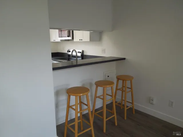 a kitchen with a table and chairs in it