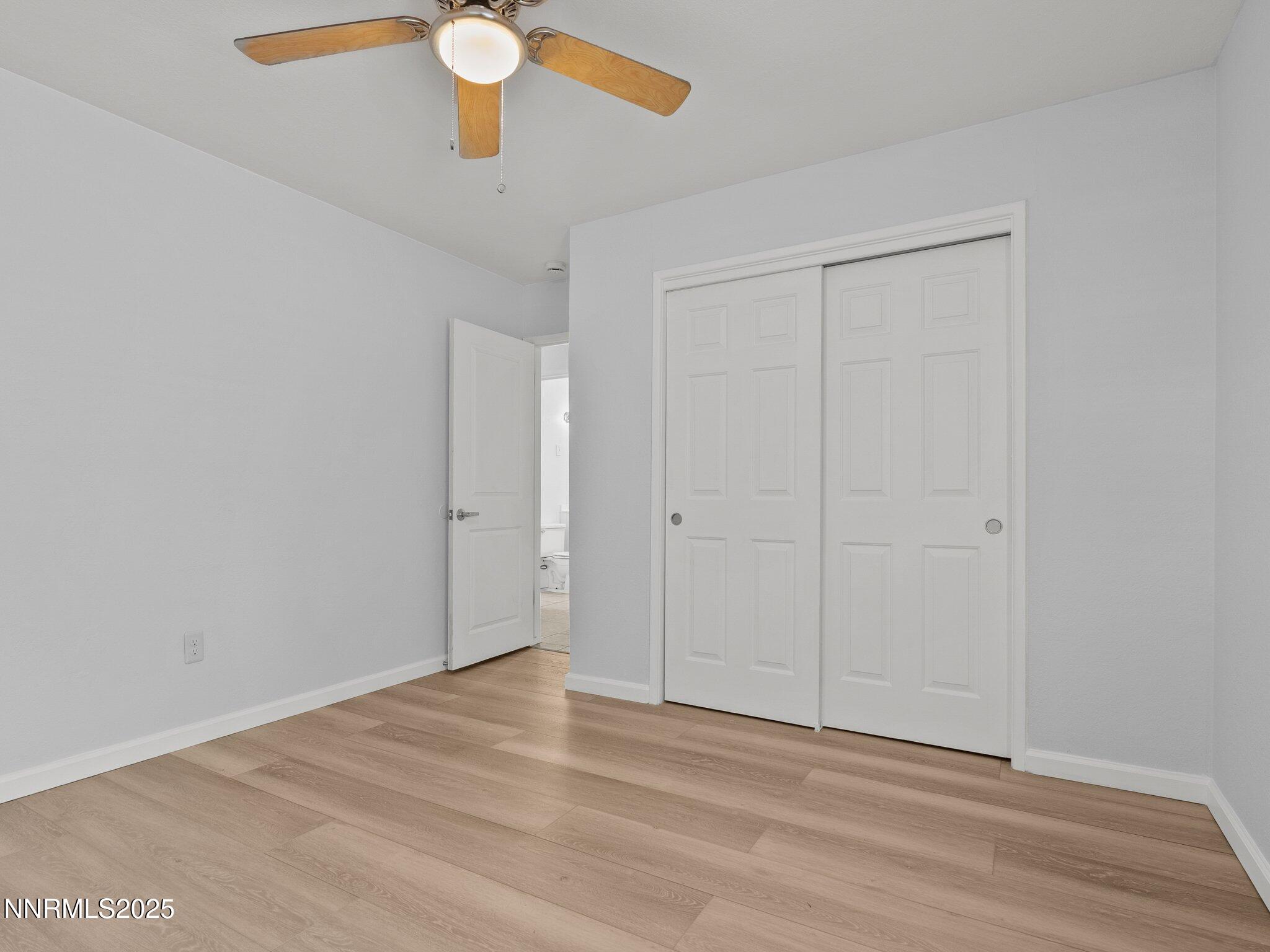 1955 Wilder Street Reno, NV 89512 - Photo 20 of 31 a view of an empty room with wooden floor