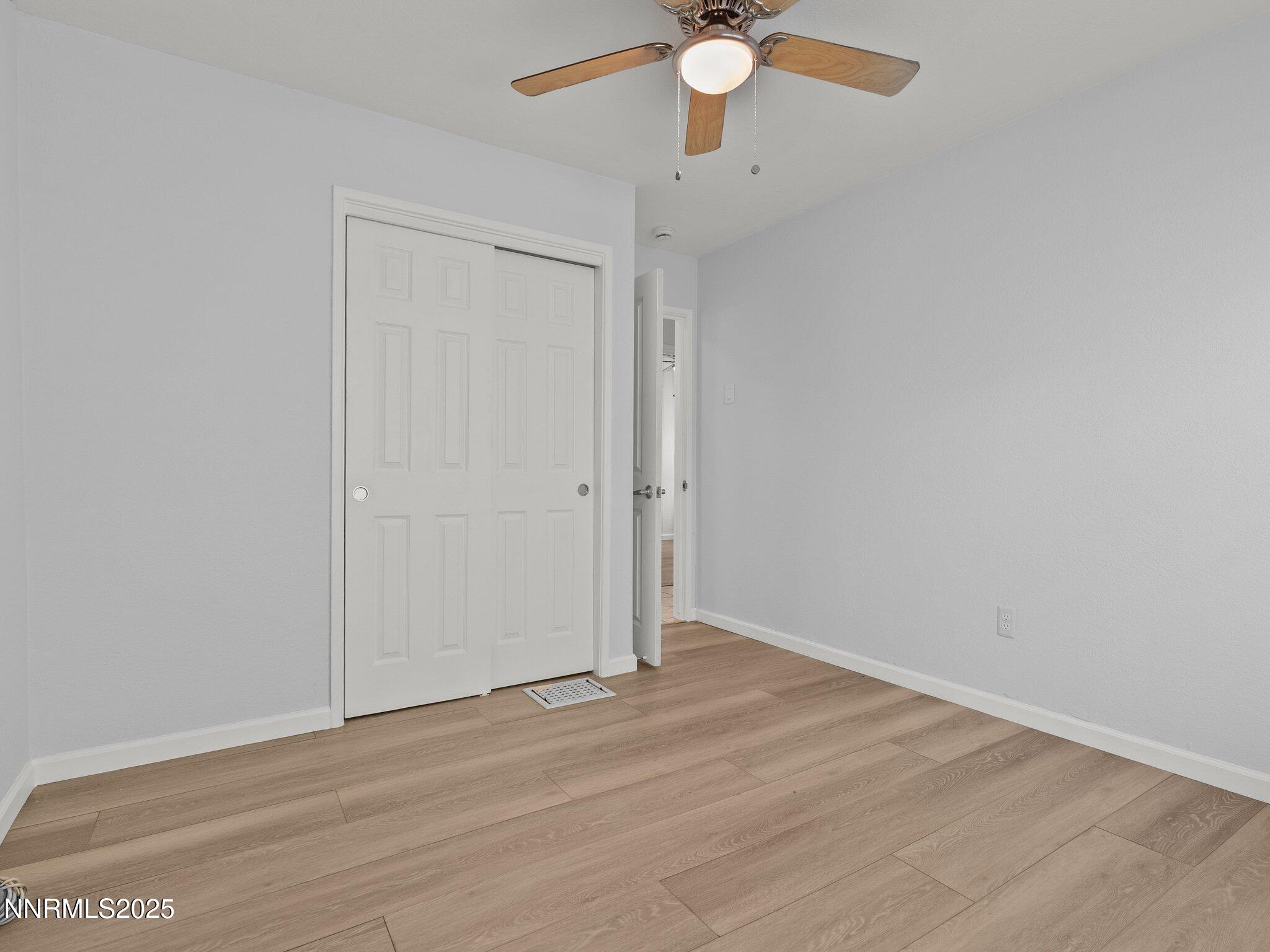 1955 Wilder Street Reno, NV 89512 - Photo 21 of 31 an empty room with wooden floor