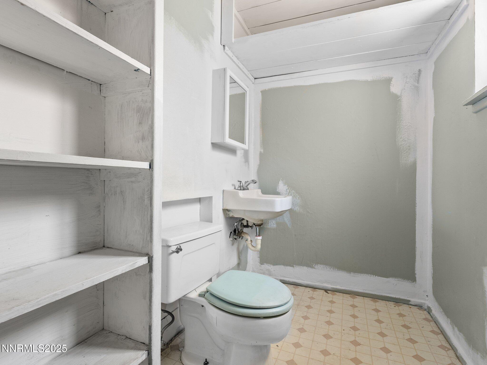 1955 Wilder Street Reno, NV 89512 - Photo 26 of 31 a bathroom with a sink a toilet and shower