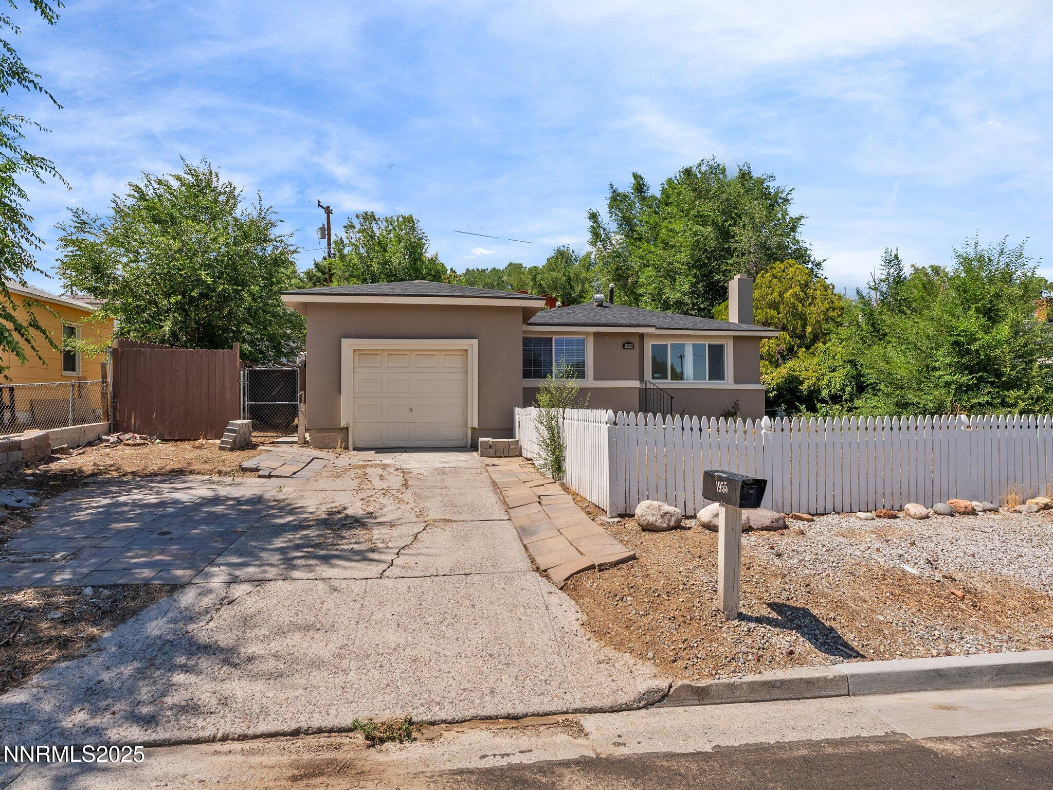 1955 Wilder Street Reno, NV 89512 - Photo 29 of 31 a front view of a house with garden