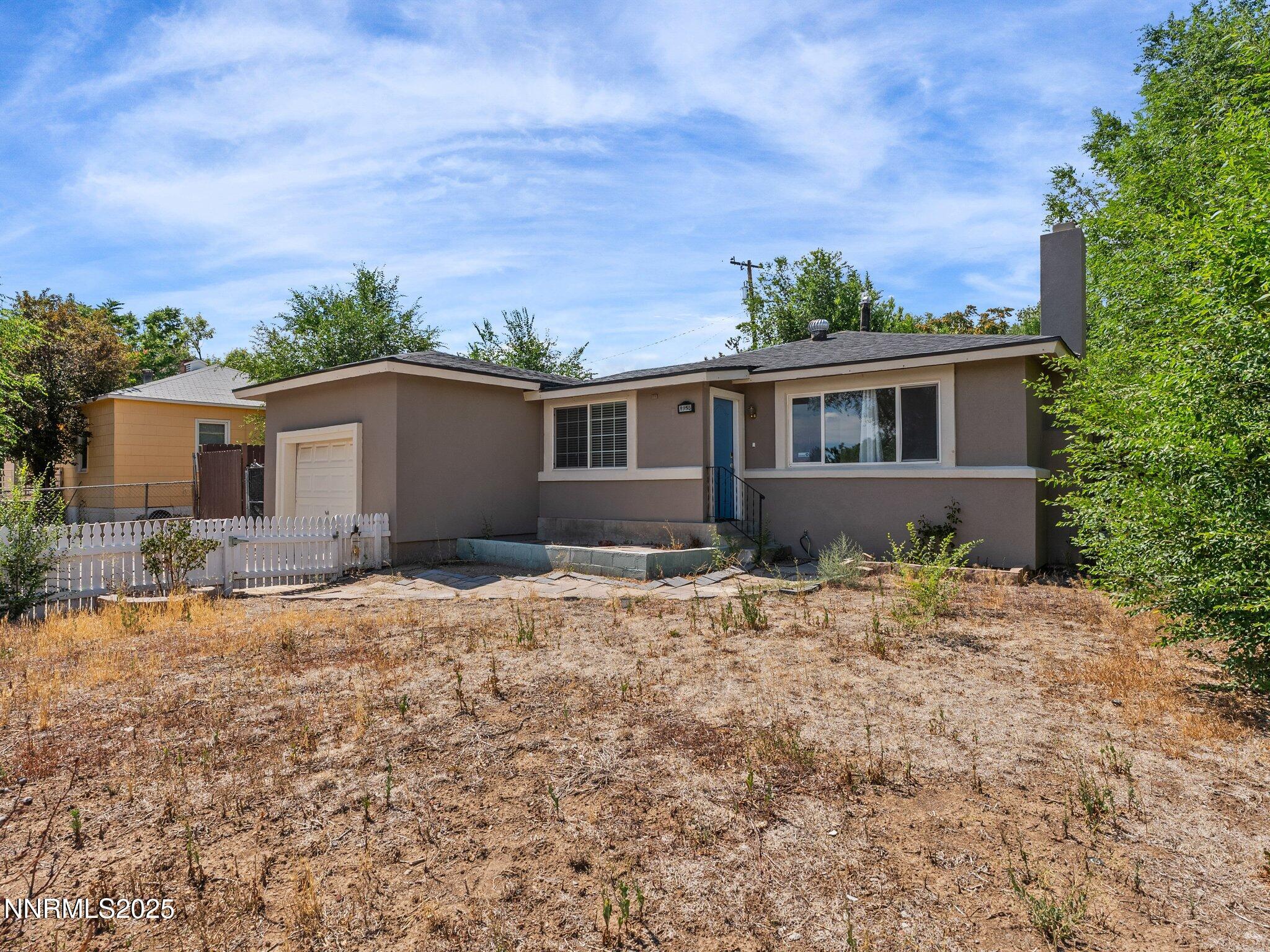 1955 Wilder Street Reno, NV 89512 - Photo 3 of 31 front view of house with a yard