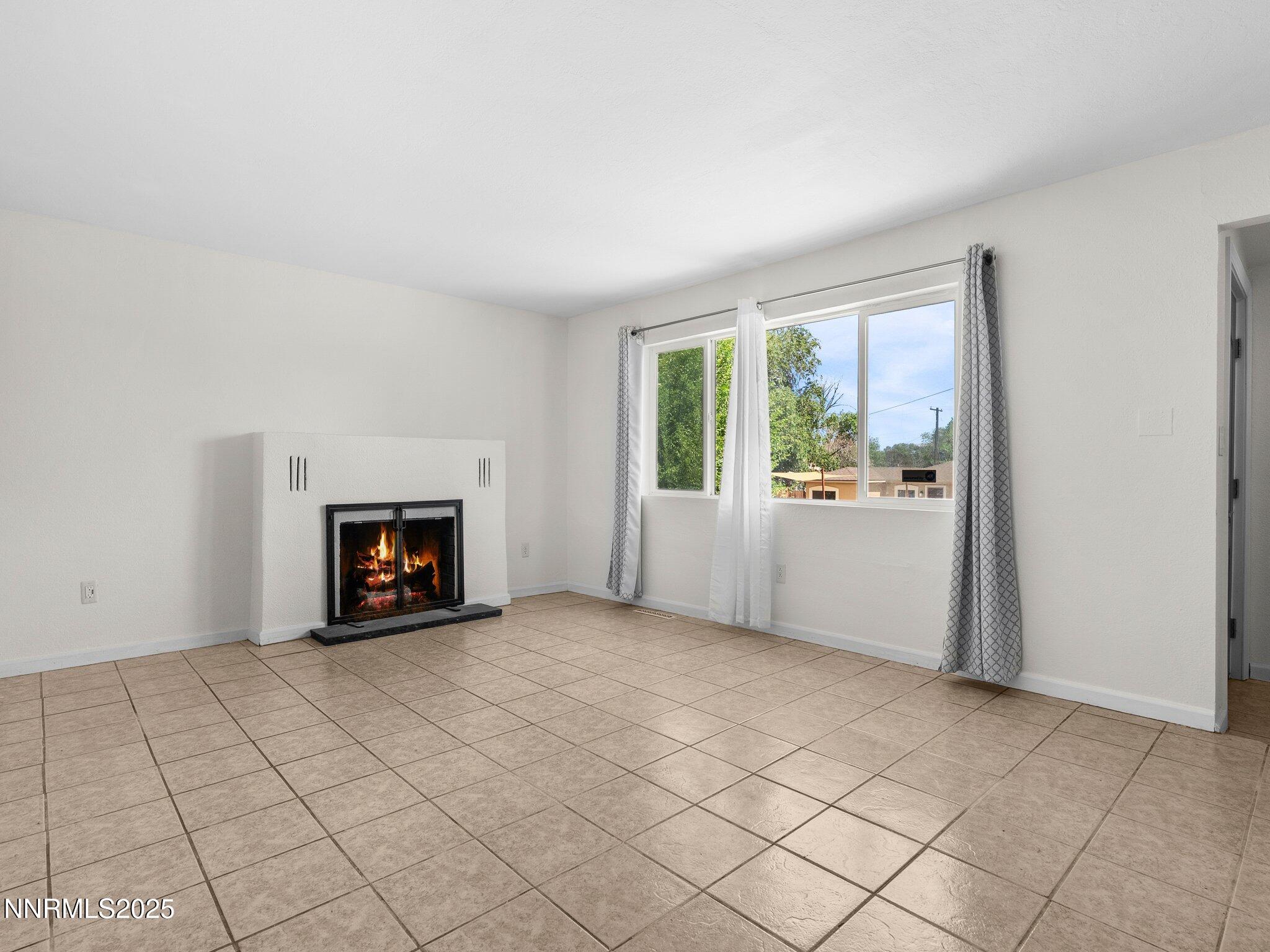 1955 Wilder Street Reno, NV 89512 - Photo 6 of 31 an empty room with windows