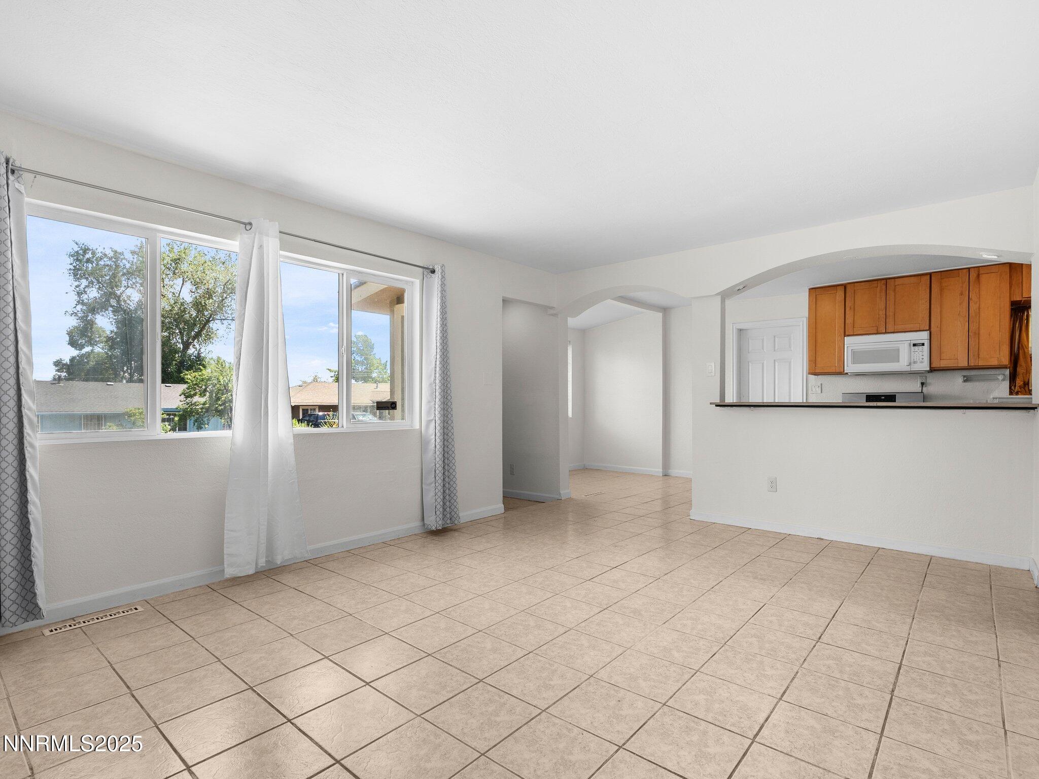 1955 Wilder Street Reno, NV 89512 - Photo 7 of 31 a view of a room with window and stairs
