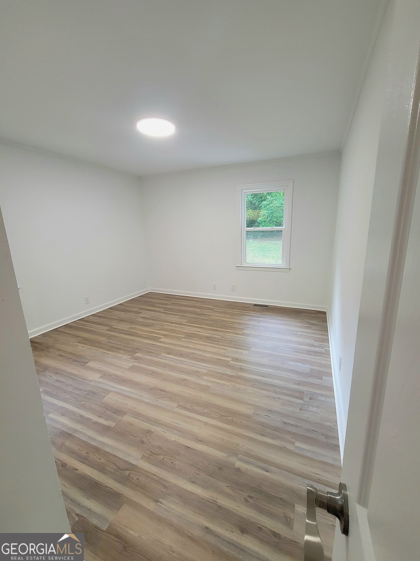 506 East 6th Street West Point, GA 31833 - Photo 12 of 15 a view of room with window and hardwood floor