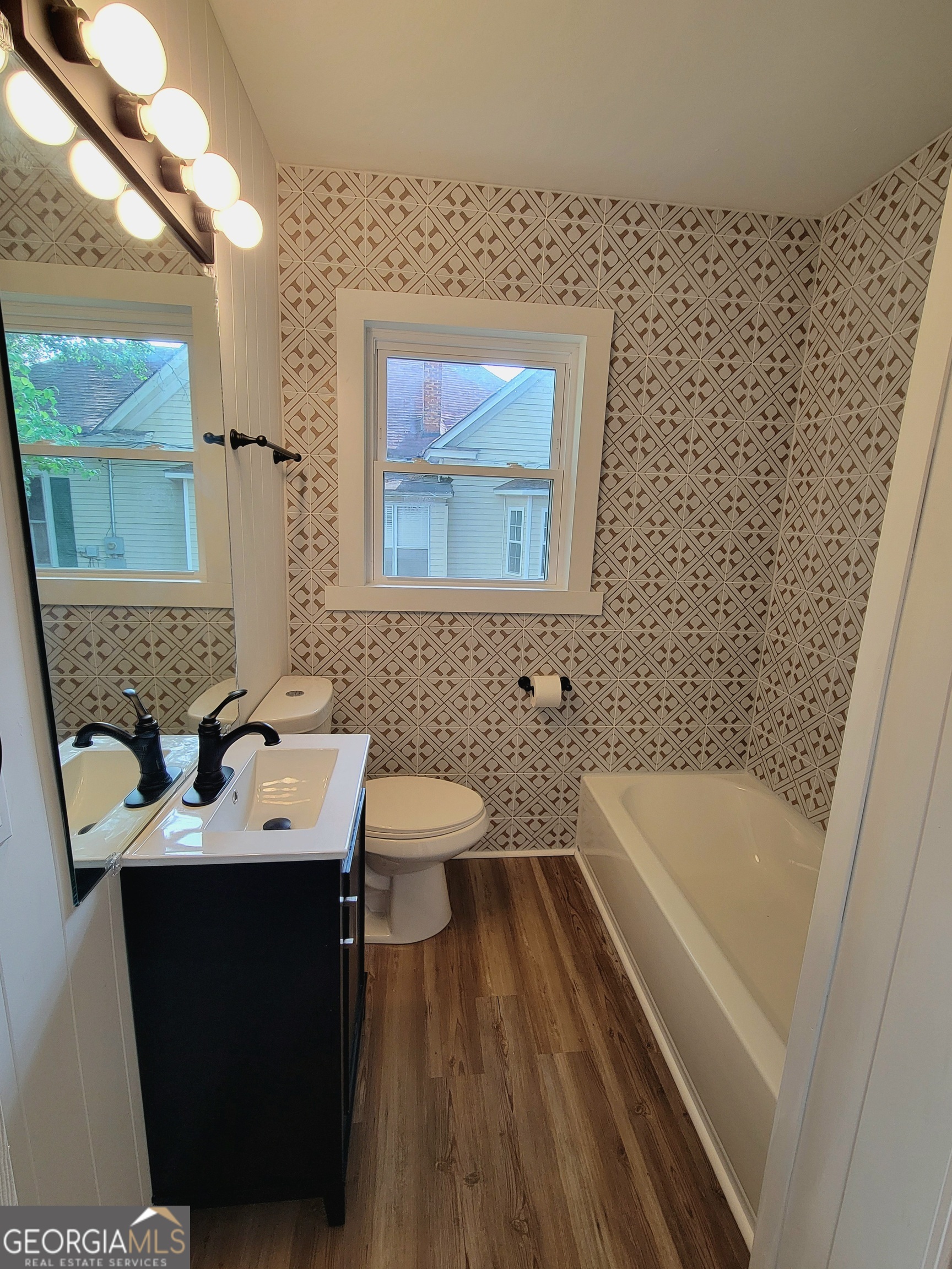 506 East 6th Street West Point, GA 31833 - Photo 14 of 15 a bathroom with a sink and a bathtub