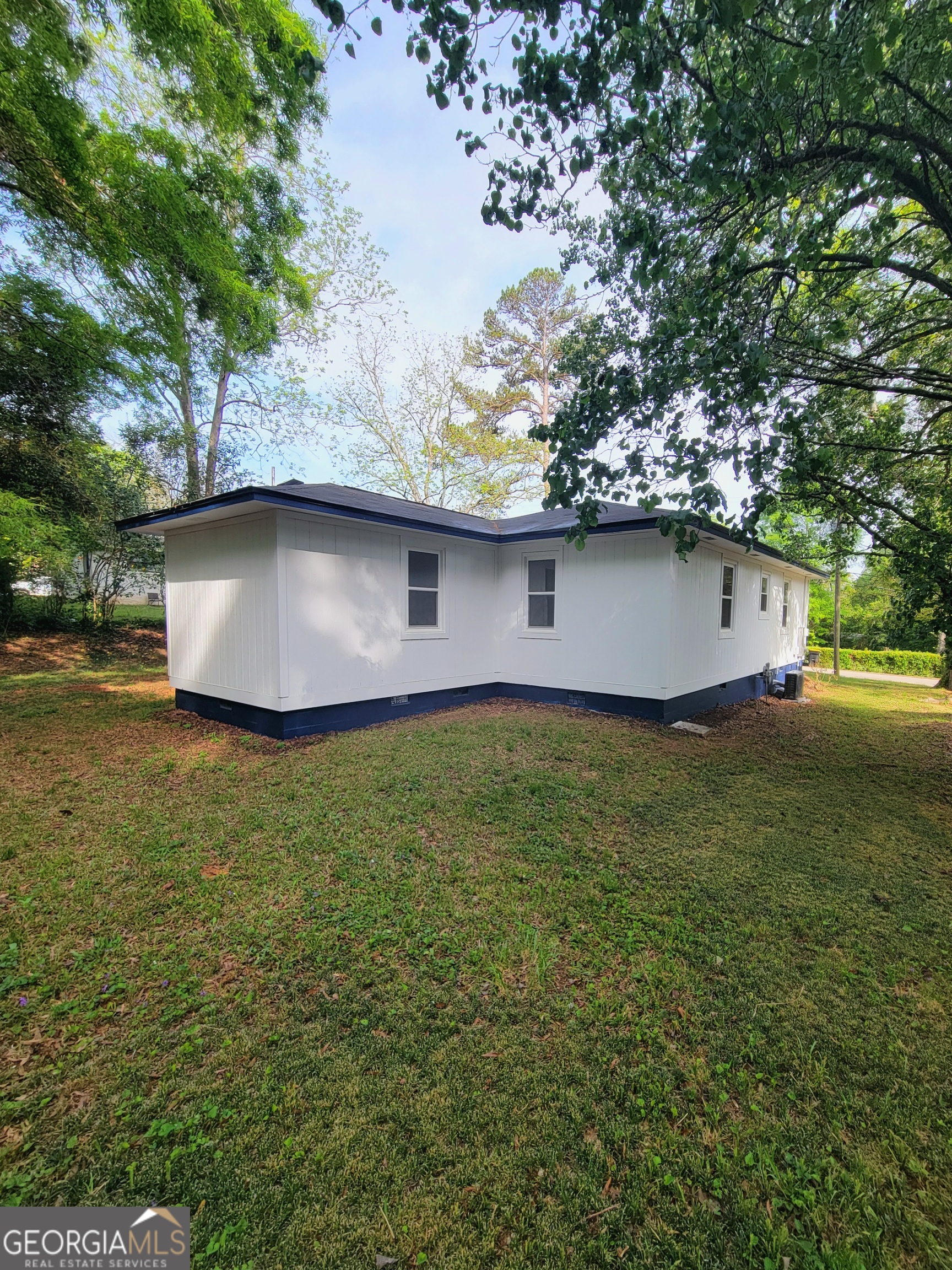 506 East 6th Street West Point, GA 31833 - Photo 3 of 15 a front view of house with garden space and trees