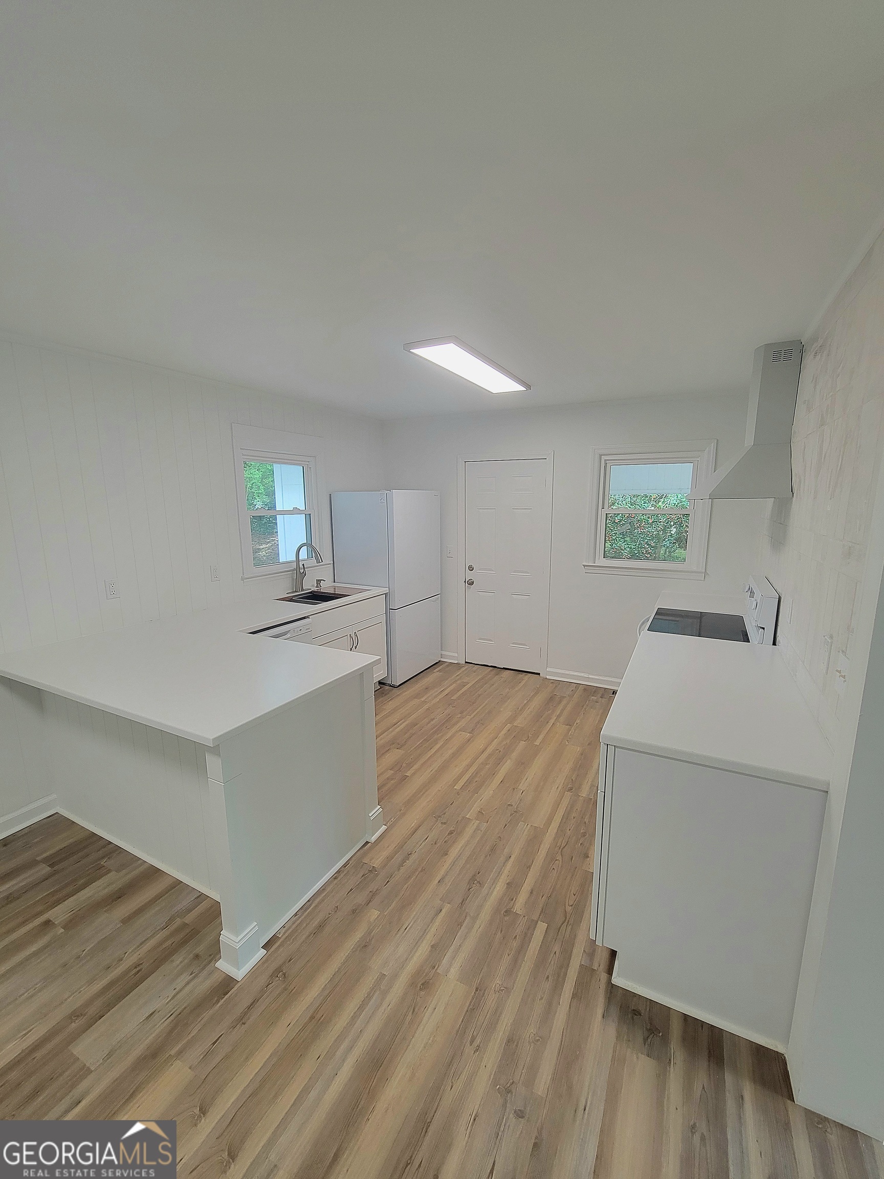506 East 6th Street West Point, GA 31833 - Photo 7 of 15 a room with a bed and cabinets