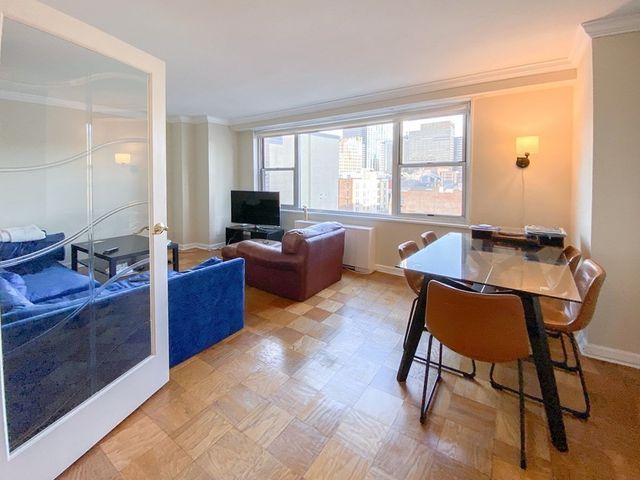 a view of a workspace with furniture