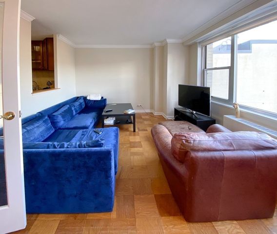 a kitchen with a sink a stove and cabinets