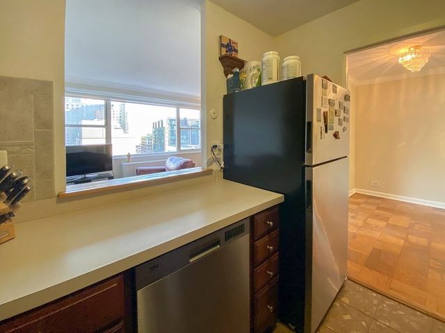 a bedroom with a bed a desk and chair