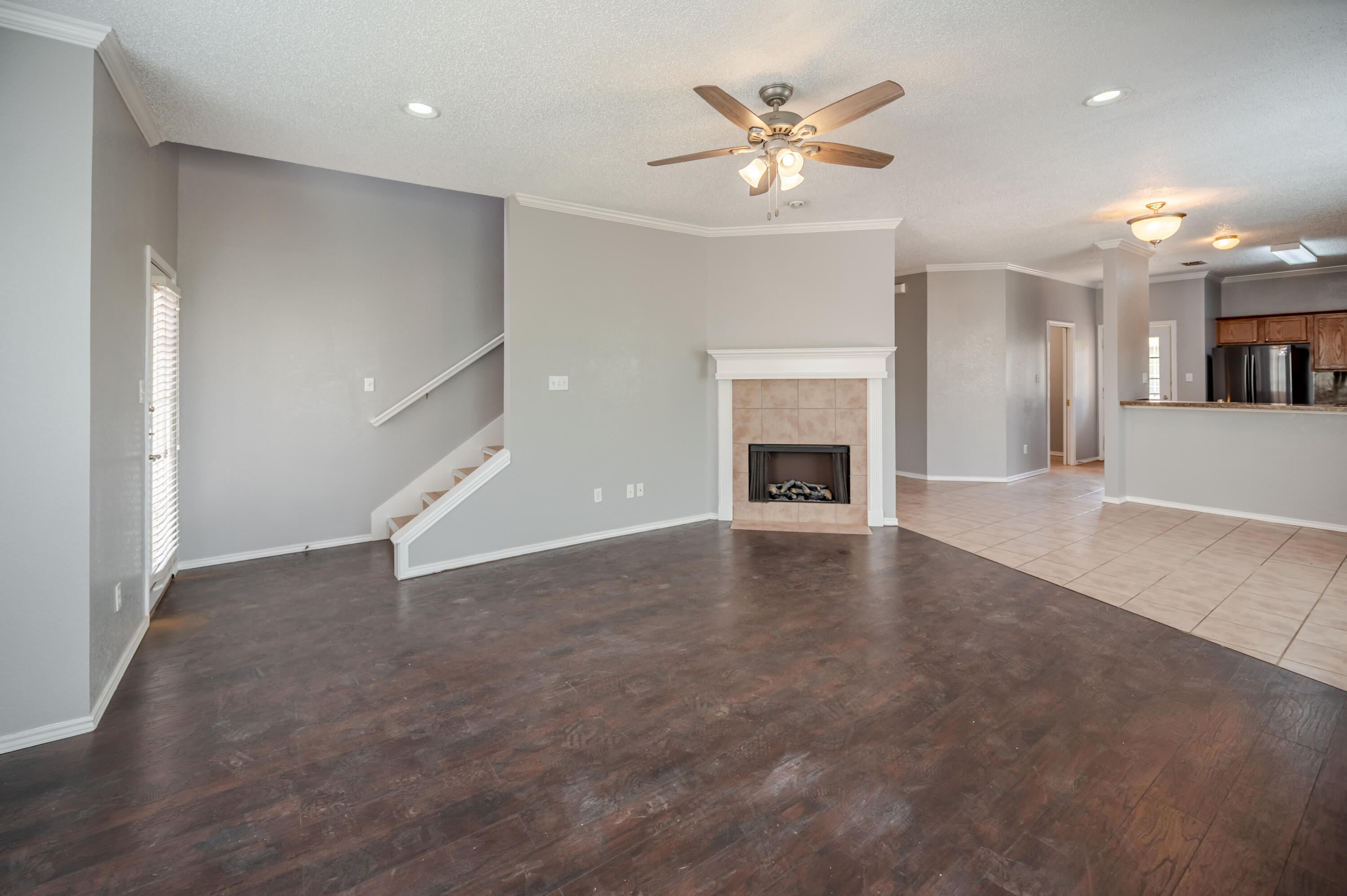 2111 Main Street, Unit 1 Lubbock, TX 79401 - Photo 9 of 36 an empty room with windows and fireplace