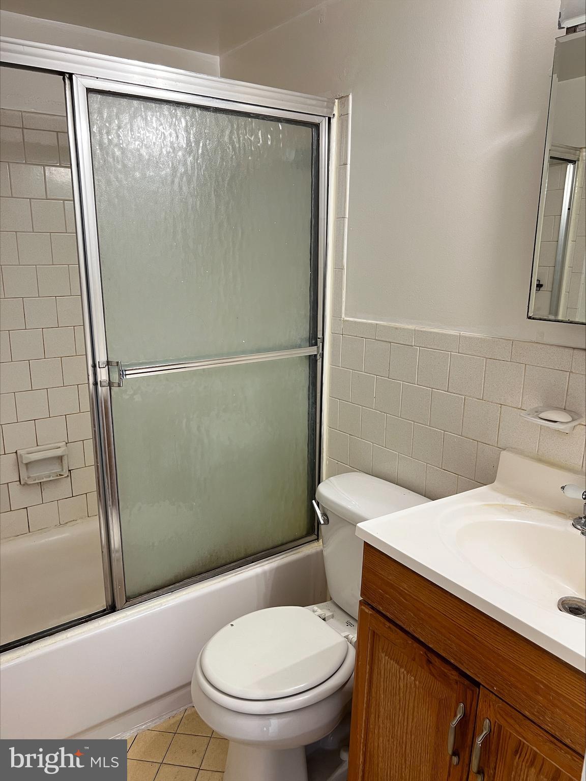 9802 Georgia Avenue, Unit 304 Silver Spring, MD 20902 - Photo 7 of 9 a bathroom with a toilet a sink and shower